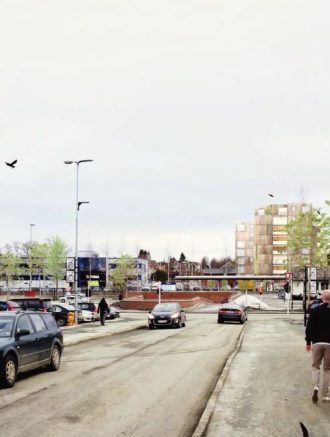 Urbant preg: Tog, superbuss, park og boliger samles ved det nye knutepunktet i Heimdal sentrum. Bildet er tatt fra Ringvålvegen mot stasjonen og viser to av tre boligblokker som skal bygges.